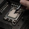 Aeronaut thermal paste being applied from the syringe onto a processor in its motherboard socket