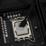 TG Spatula spreading thermal paste evenly across a processor in its motherboard socket