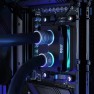 Matte nickel DeltaMate compression fittings with tubes on a CPU water block, lighting on, inside a PC