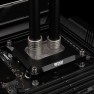 Matte nickel DeltaMate male to female extender raising a compression fitting on a CPU water block