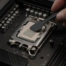 Hydronaut thermal paste being spread across a processor with a spatula