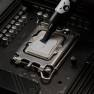 Kryonaut thermal paste being spread across a processor with the spatula attached to the syringe