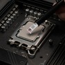 A dab of Kryonaut Extreme thermal paste placed on a processor with the spatula attached to the syringe