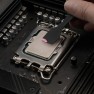 A dab of Kryonaut Extreme thermal paste placed on a processor with a spatula