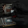 Putty Pro being scooped from the jar with a spatula, over an opened graphics card