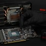 Putty Pro being applied to a graphics card with a spatula, gloves on