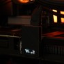 WireView Pro plugged into a graphics card inside a PC, its display showing temperature readings